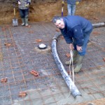 Bottom drain Sumps fitted,steel Reinforcing laid and cement being pumped in.